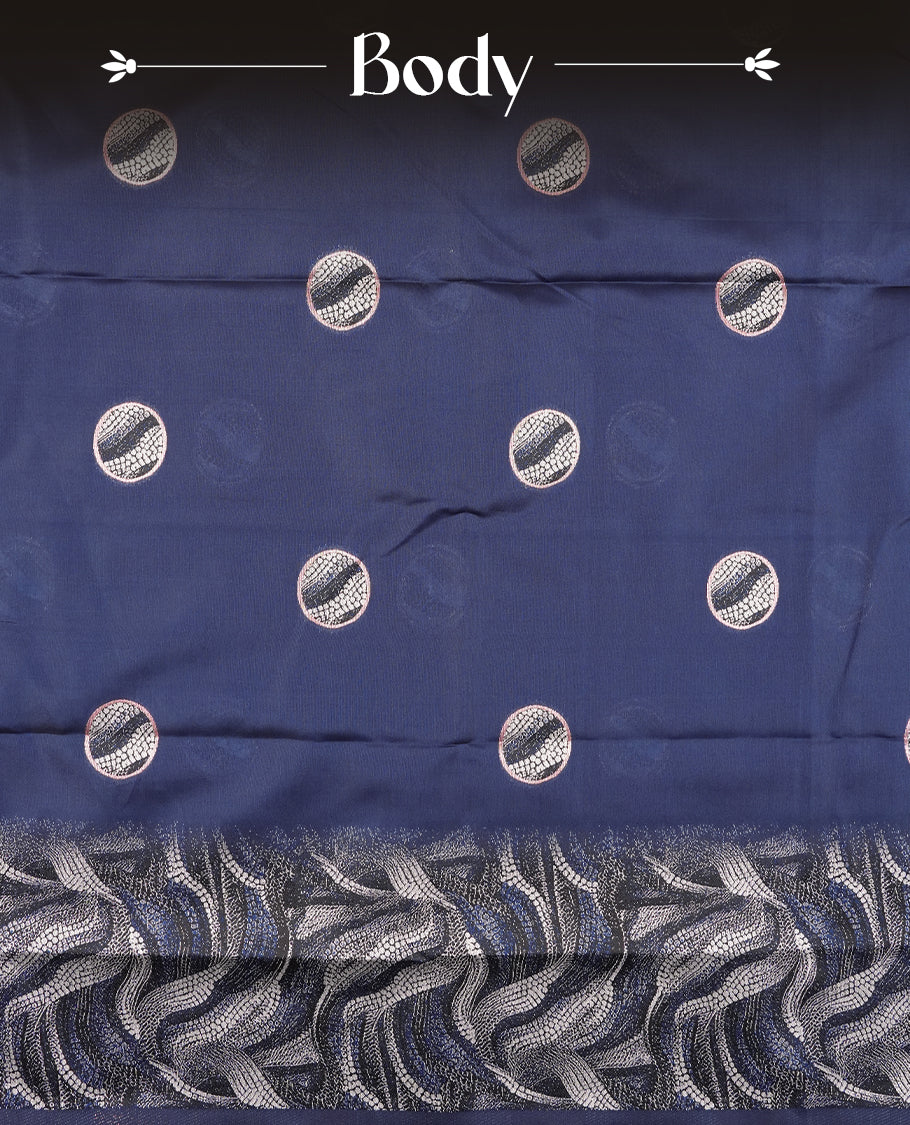 Dark blue semi silk saree featuring elegant circular motifs on the body, complemented by a striking pallu adorned with intricate wavy white thread patterns with golden border, and paired with a matching blouse