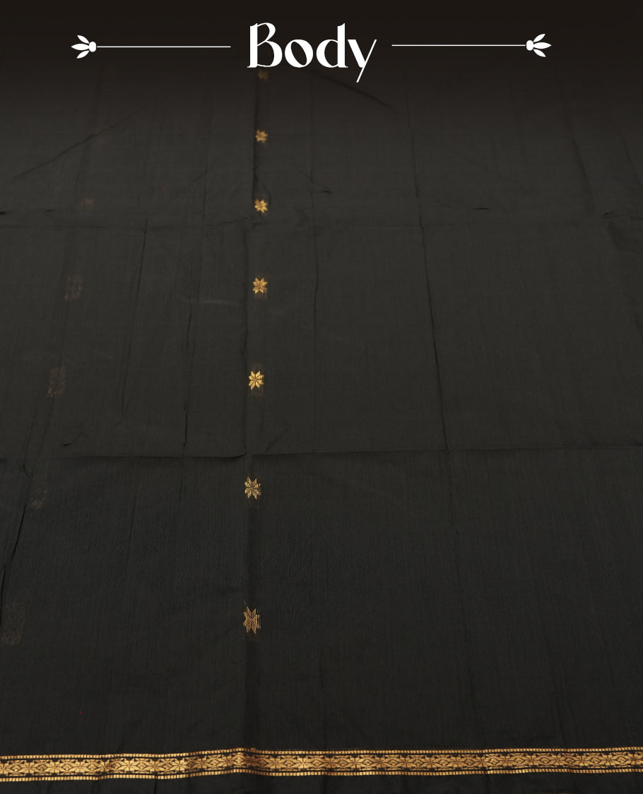 Black colour Silk Cotton Saree with Tiny Gold Zari Star Buttas on the Body, Antique Gold Tissue Panel on the Pallu, Slim Floral Zari Borders, and a Plain Black Blouse with Matching Border
