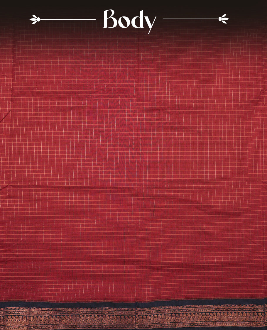 Dark Red coloured mixed Kalyani cotton saree featuring copper zari checks on the body, complemented by a Navy Blue coloured border and pallu adorned with copper zari patterns, Paired with a matching blouse.