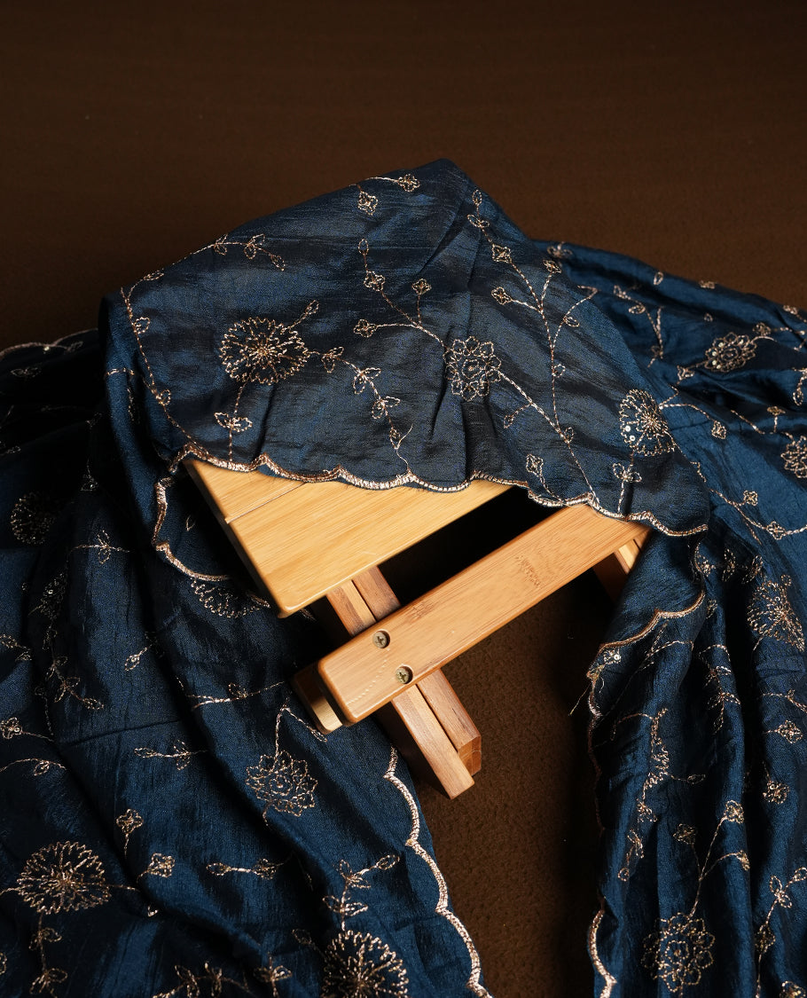 Golden Cream colour churidhar material featuring thread embroidery on the front panel, contrast Dark Teal colour dupatta with elegant border, and matching plain bottom