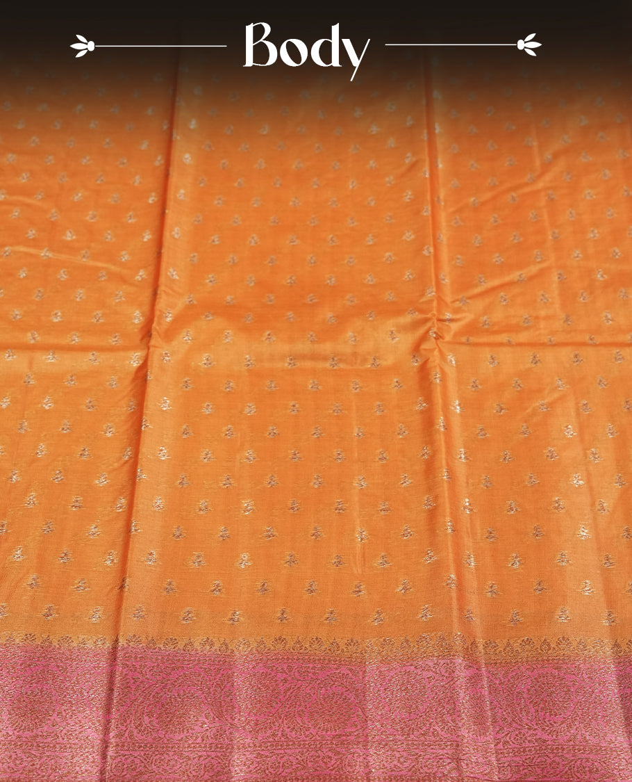 Copper toned colour pure banarasi tussar saree adorned with subtle silver zari motifs all over, complemented by a rich contrast magenta Banarasi border & Comes with a matching blouse piece.