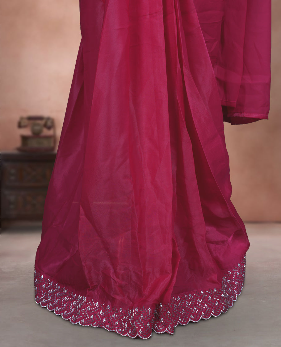 Elegant Rani pink Colour ready to wear saree adorned with rich silver stone and bead embroidery along the border and pallu, paired with a heavily embellished matching blouse for a grand festive look.