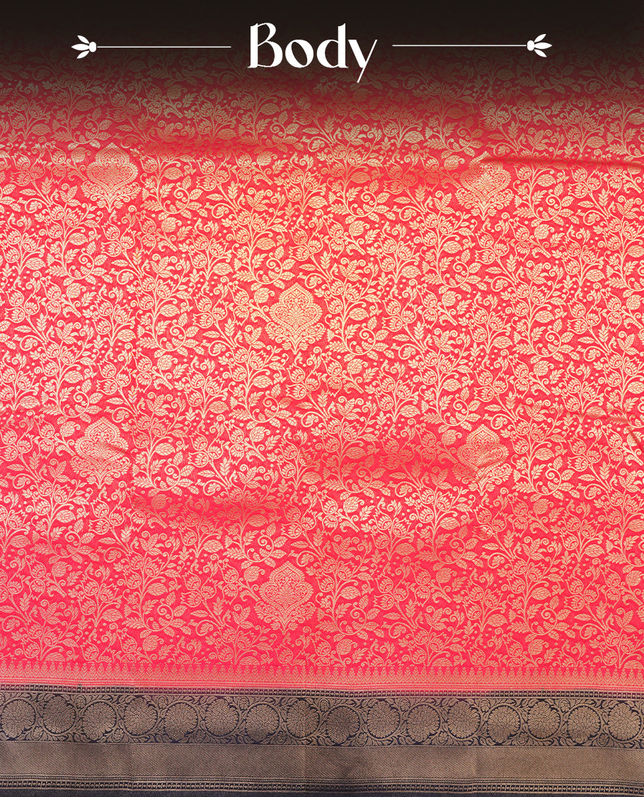 Red colour semi silk brocade saree featuring intricate Gold Floral kodi patterns across the body, complemented by a contrast navy blue colour woven border and pallu, paired with a matching blouse.