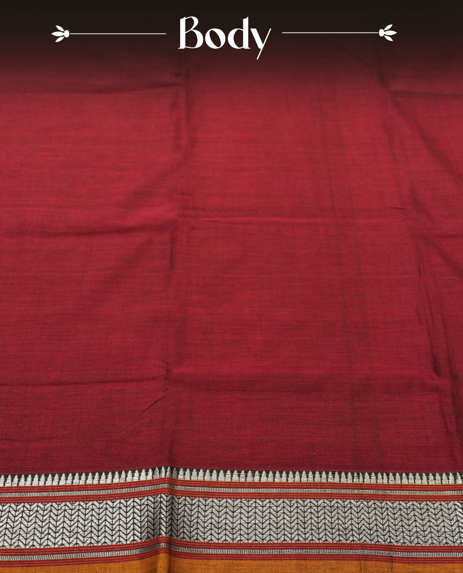 Dark Maroon colour Narayanapattu cotton saree featuring a self coloured body, yellow coloured with silver zari pattern border and pallu, pairing a matching blouse piece.