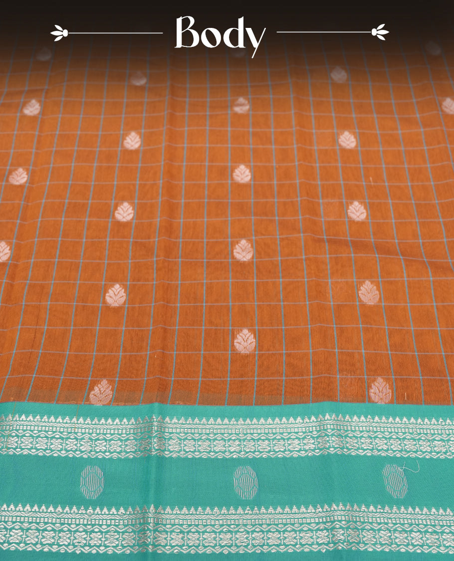 Orange Silk Cotton Saree with White Floral Buttas Body, Accented by White Lotus and Geometric Pattern on Green and Blue Zari Pallu, Paired with Matching Blouse Piece
