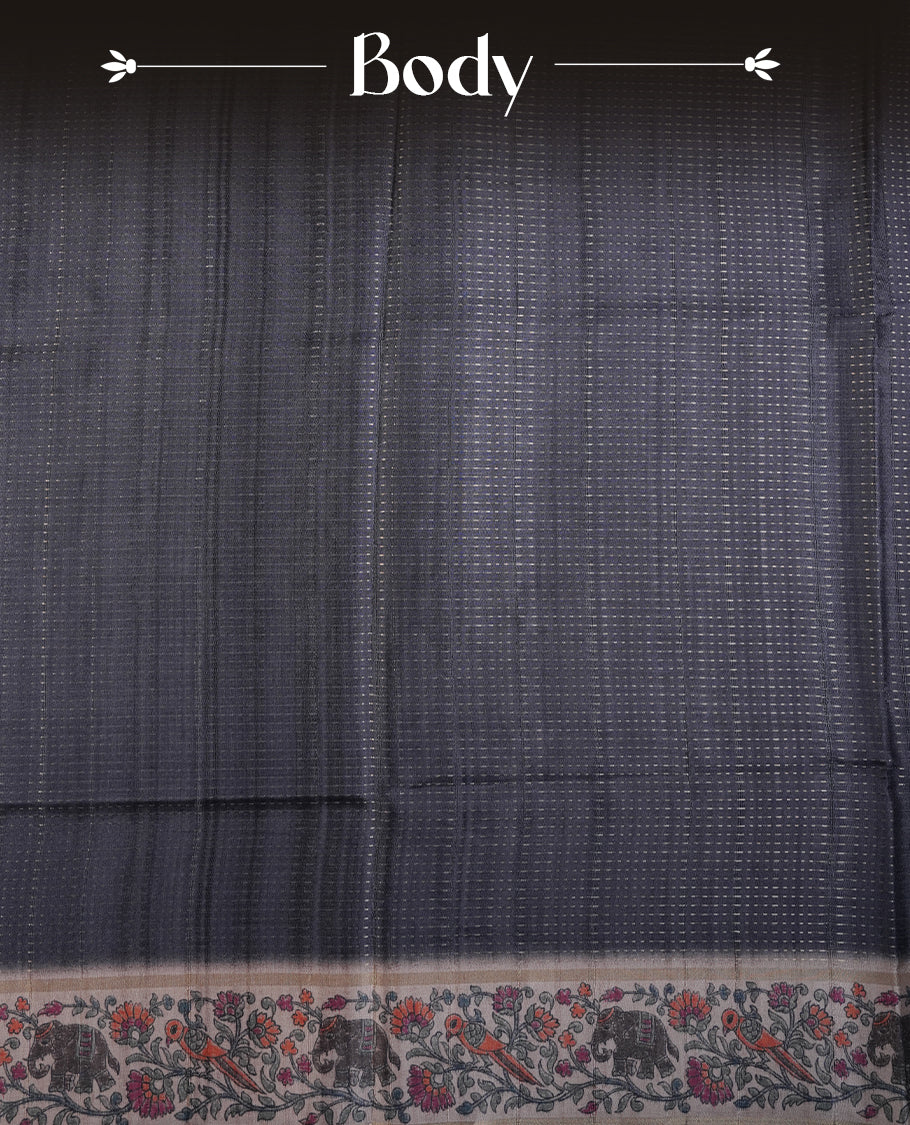 Charcoal black colour tussar saree featuring golden zari dot stripped pattern on the body, complemented by a contrast cream colour mutlicolour floral kodi & animal print on border & pallu, paired with a matching blouse.