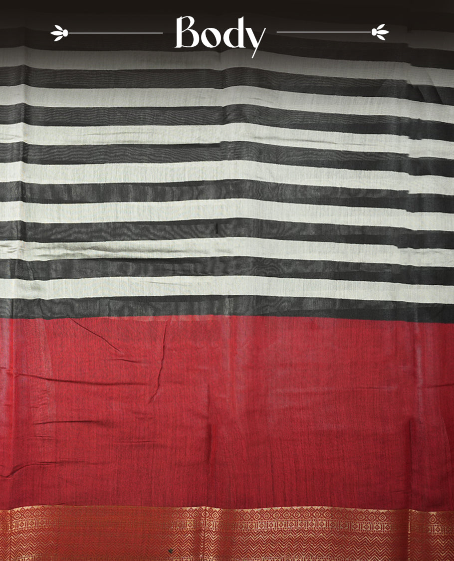 Maroon red colour mixed chanderi cotton saree with plain body, geometric tribal printed pallu with golden zari border, and striped blouse.