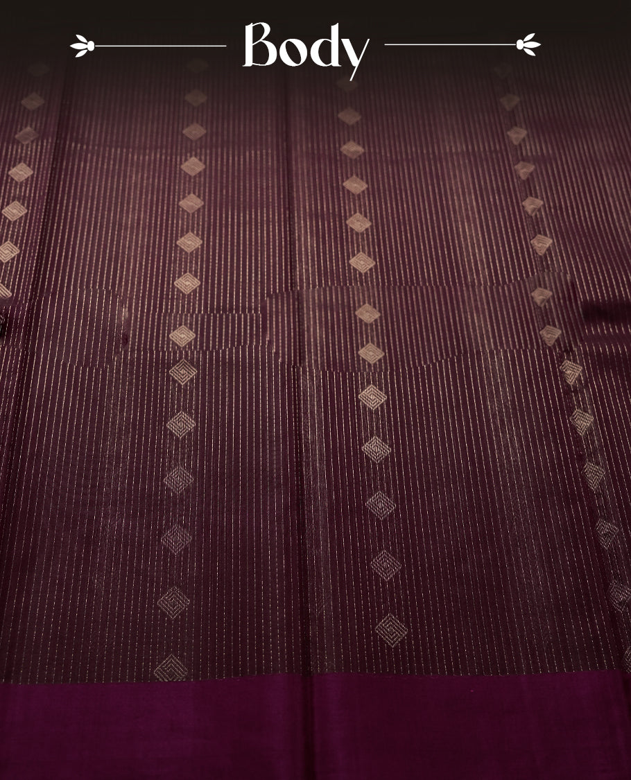 Dark Maroon colour pure Handloom cotton saree featuring fine golden stripes with delicate motifs, paired with a rich zari magenta border for a traditional yet elegant look, perfect for graceful occasions & Comes with matching blouse.