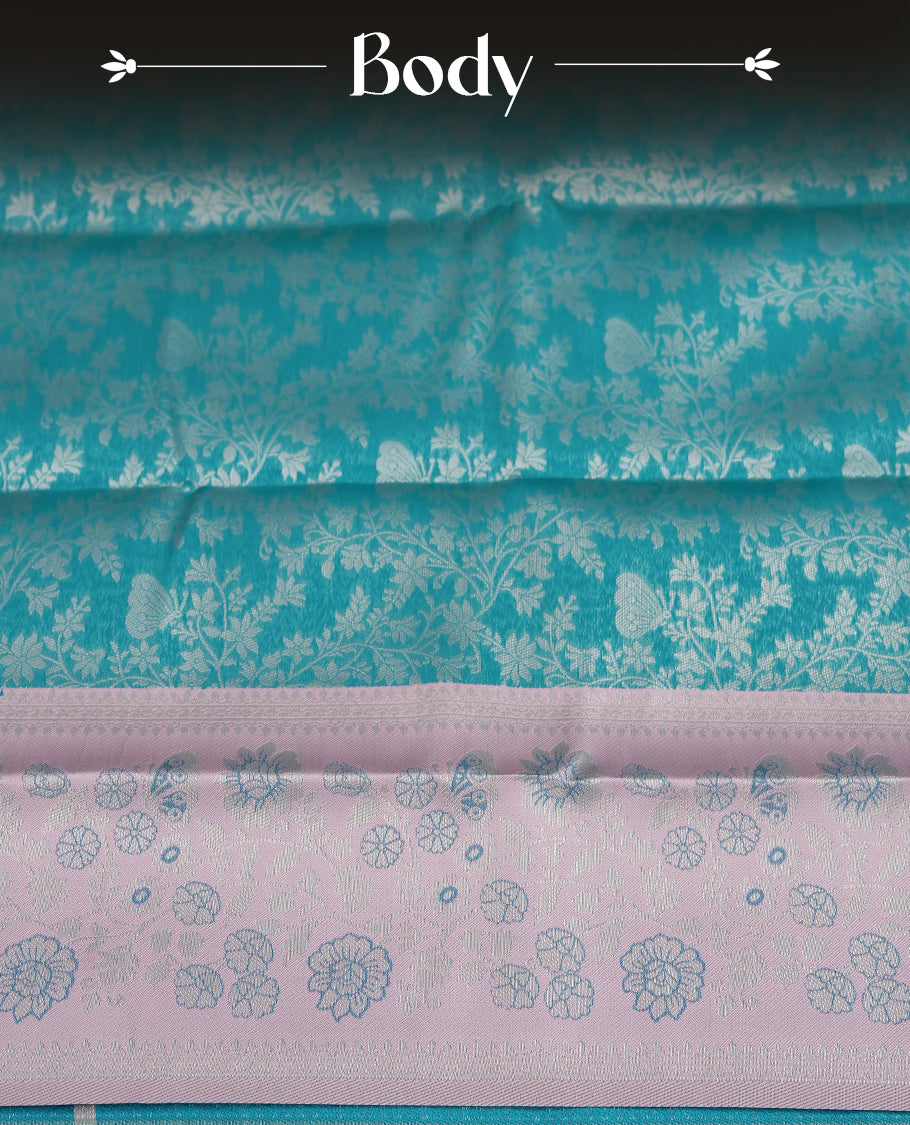 Aqua blue colour semi silk saree adorned with silver zari designs on the body, complemented by a contrasting Aqua blue border and pallu, and paired with a matching blouse piece