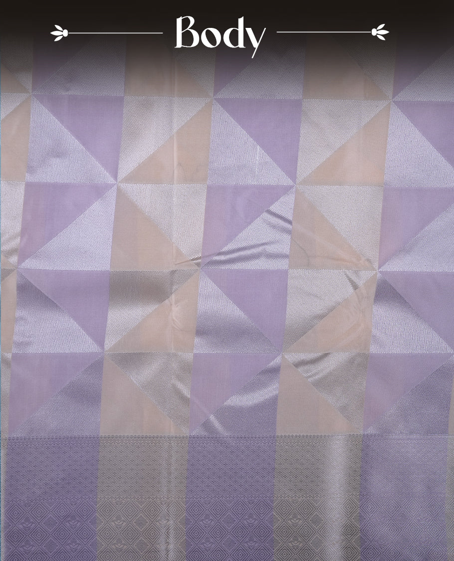 Lavender & cream colour semi soft silk saree featuring a silver zari patterned body, complemented by silver zari motifes on pallu & border and a matching blouse piece.