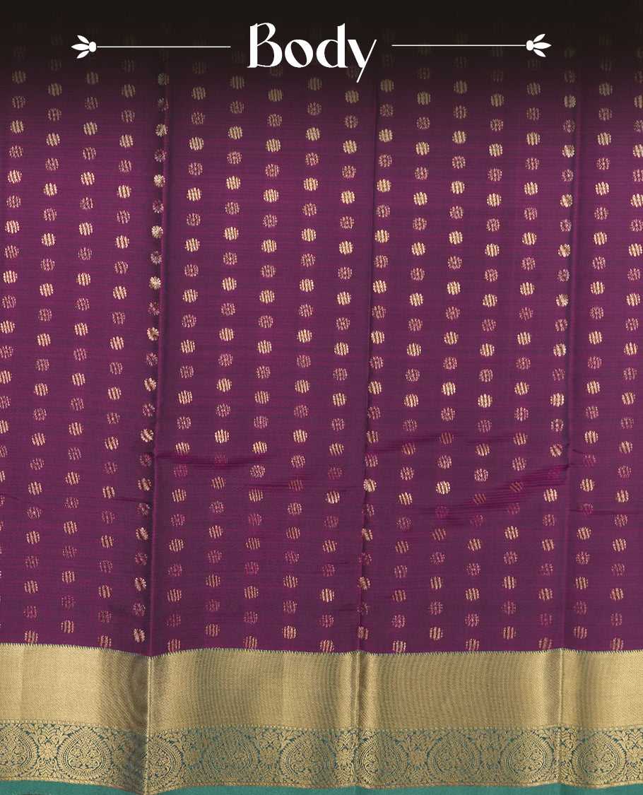 Very Dark purple colour semi soft silk saree featuring a gold coloured textured patterned body, complemented by contrast green with golden zari motifes on pallu & border and a matching blouse piece.