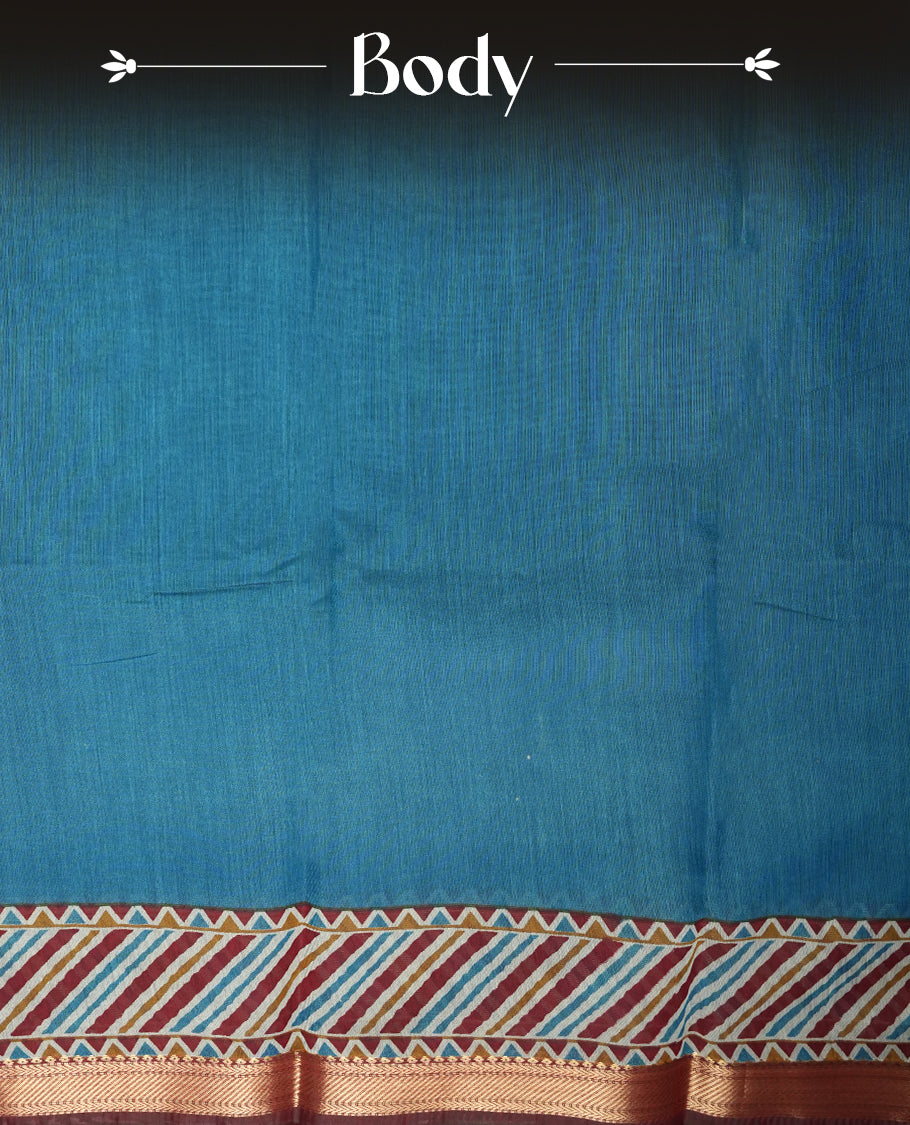 Teal blue colour mixed chanderi cotton saree with plain body, multicolor striped and geometric pallu with triangle patterns, maroon and golden zari border, and matching maroon blouse.