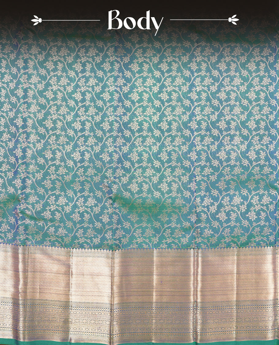 Peacocok colour Kanchipuram Samudrika Silk Saree featuring Floral kodi pattern weaving with rose gold zari jacquard and a traditional zari border, paired with a matching designer jacquard blouse piece