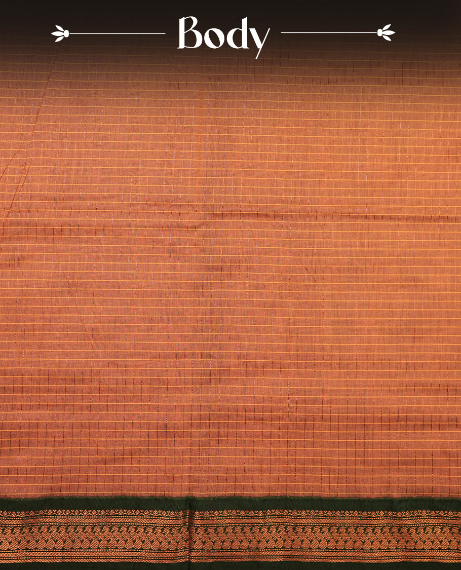 copper coloured mixed Kalyani cotton saree featuring copper zari checks on the body, complemented by a dark green coloured border and pallu adorned with copper zari patterns, Paired with a matching blouse.