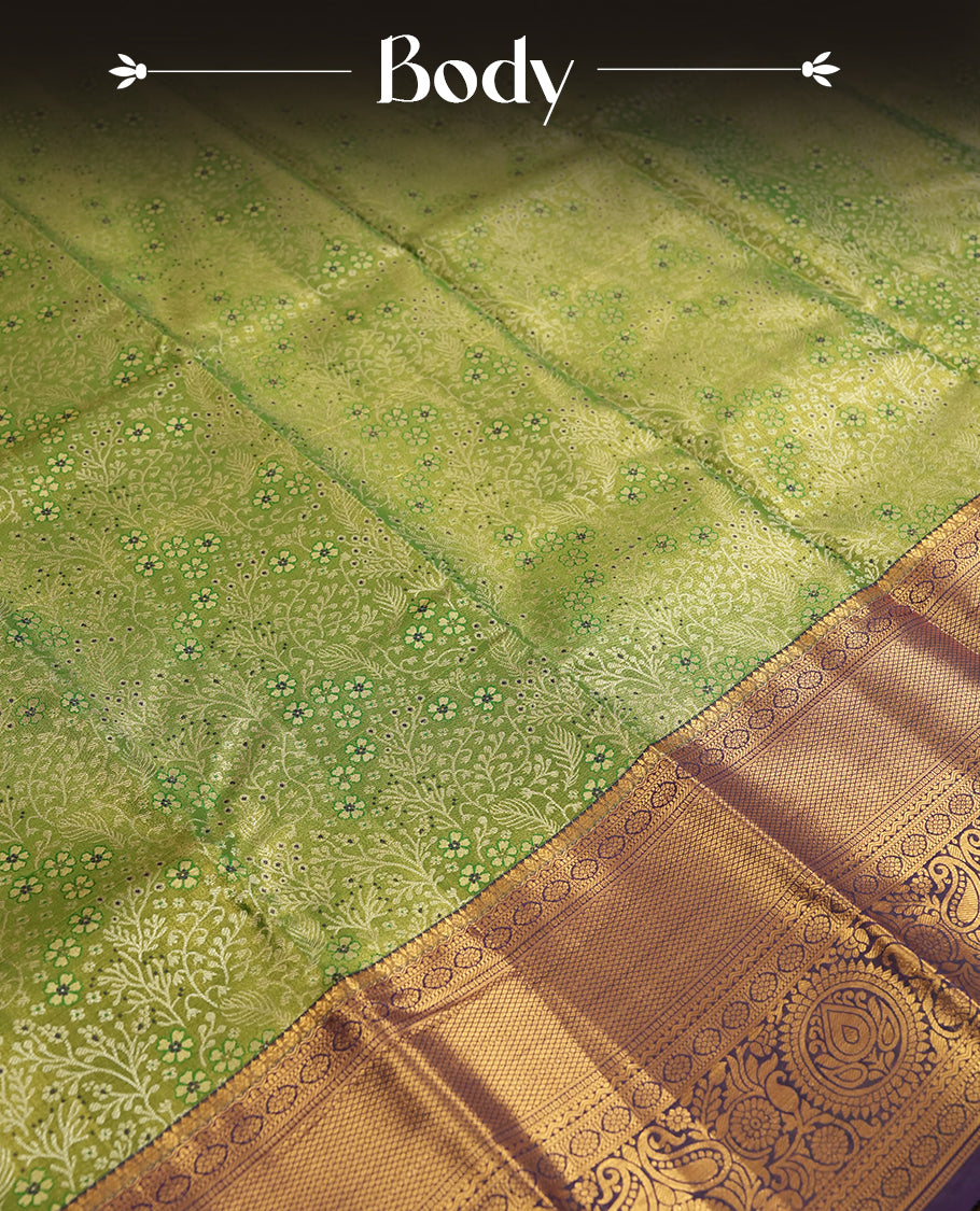 Light green colour and Antique silver Zari Tissue Brocade Saree features intricate a floral Motifs on body and a deep violet colour border & pallu with floral patterns, paired with matching blouse