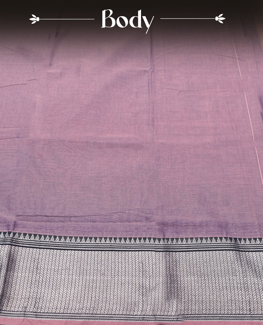 dark purple colour Narayanapattu cotton saree featuring a self coloured body, dark purple coloured with silver zari pattern border and ivory striped colour pallu, pairing a matching blouse piece.