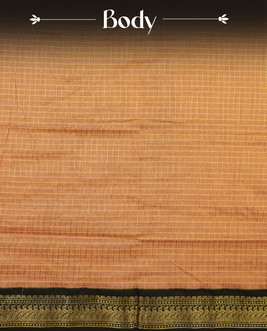 Burnt orange coloured mixed Kalyani cotton saree featuring golden zari checks on the body, complemented by a black coloured border and pallu adorned with golden zari patterns, Paired with a matching blouse.