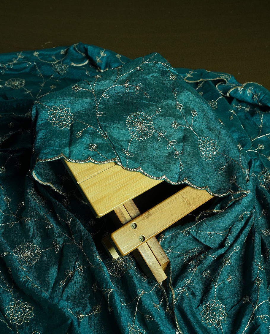 White colour churidhar material featuring thread embroidery on the front panel, contrast Green colour dupatta with elegant border, and matching plain bottom