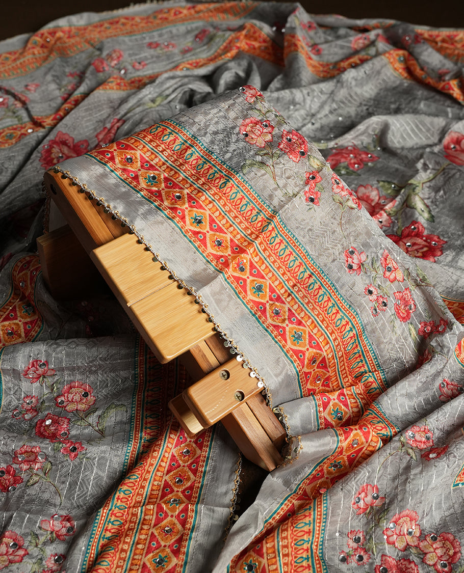 White colour churidhar material featuring Mirror and thread embroidery & foral print pattern on the contrast ash colour front panel, floral digital printed dupatta with elegant border, and matching plain bottom