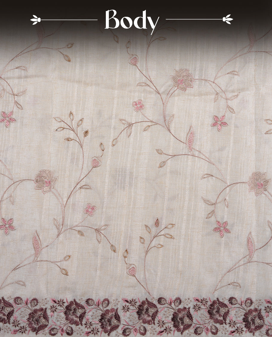 Cream colour semi tusser silk saree featuring with brown colour thread embroidery kodi pattern all over body, pallu, border  and paired with matching blouse piece.