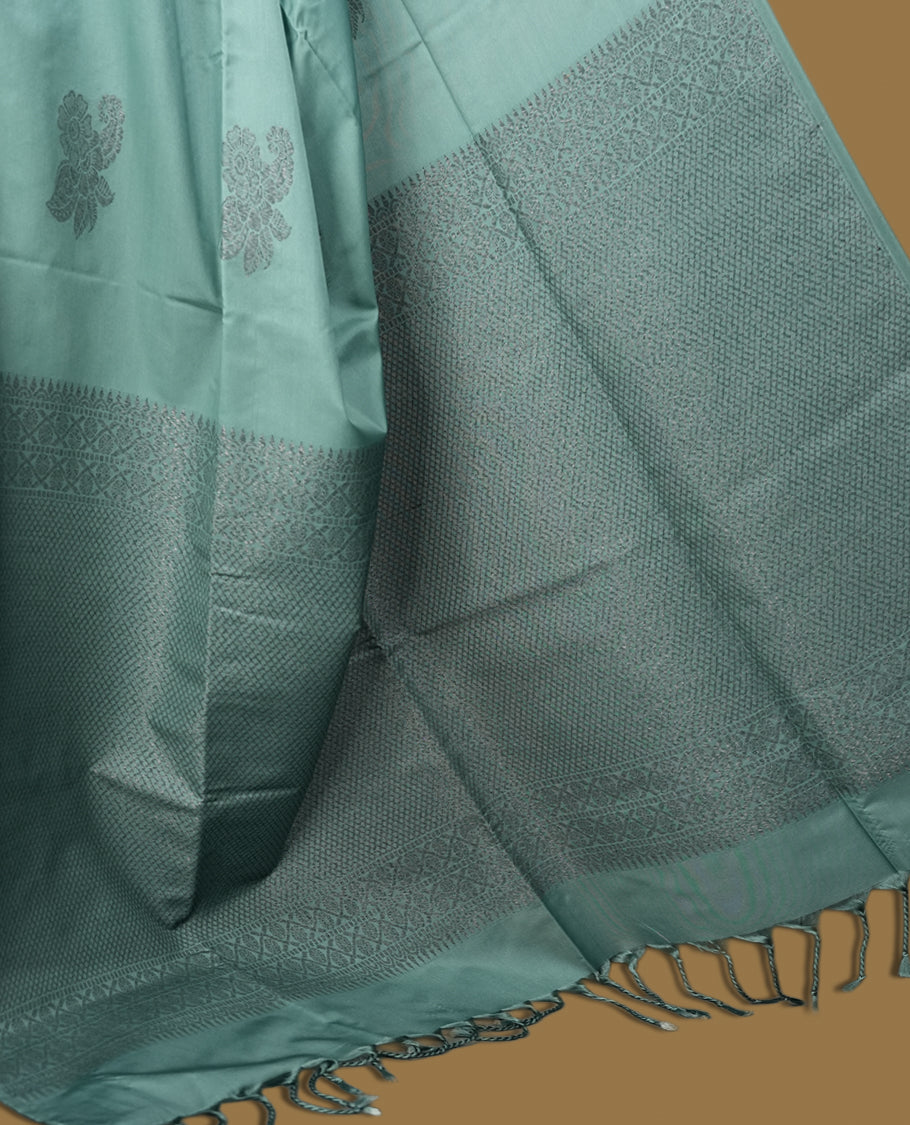 Pastel blue colour semi soft silk saree, adorned with subtle woven floral motifs on the body & The design is elevated with an elegant zari border and pallu, paired with a matching blouse.