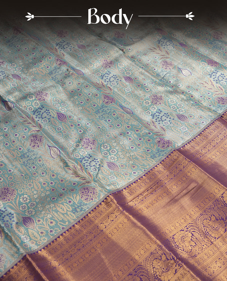 Sky blue colour and Antique gold Zari Tissue Brocade Saree features intricate coloured floral Motifs on body and a blue colour with traditional border & pallu, paired with matching blouse