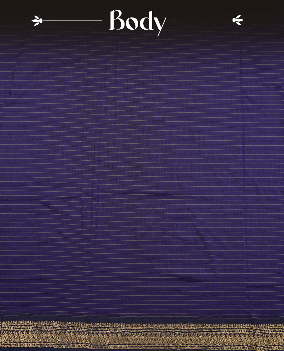 Burnt maroon coloured mixed Kalyani cotton saree featuring golden zari checks on the body, complemented by a dark royal blue coloured border and pallu adorned with golden zari patterns, Paired with a matching blouse.