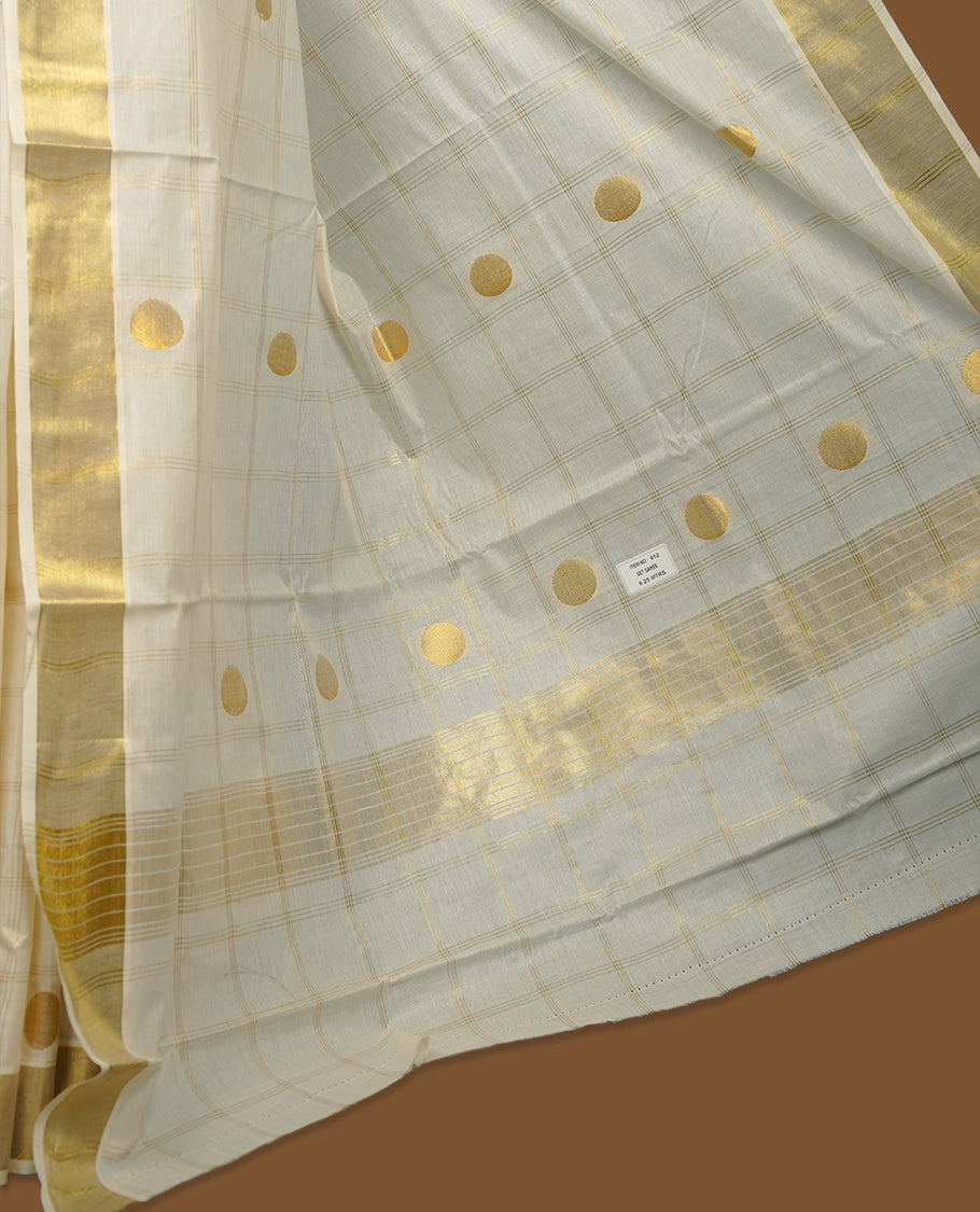 Elegant Off white colour cotton Kerala saree with gold zari check stripes and buttas, broad kasavu border, and richly woven traditional pallu, paired with a matching blouse