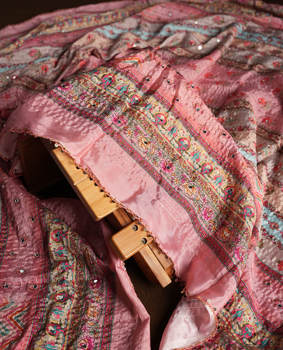 Pink colour churidhar material featuring Mirror and thread embroidery, foral print pattern on the self colour front panel, floral digital printed dupatta with elegant border, and matching plain bottom