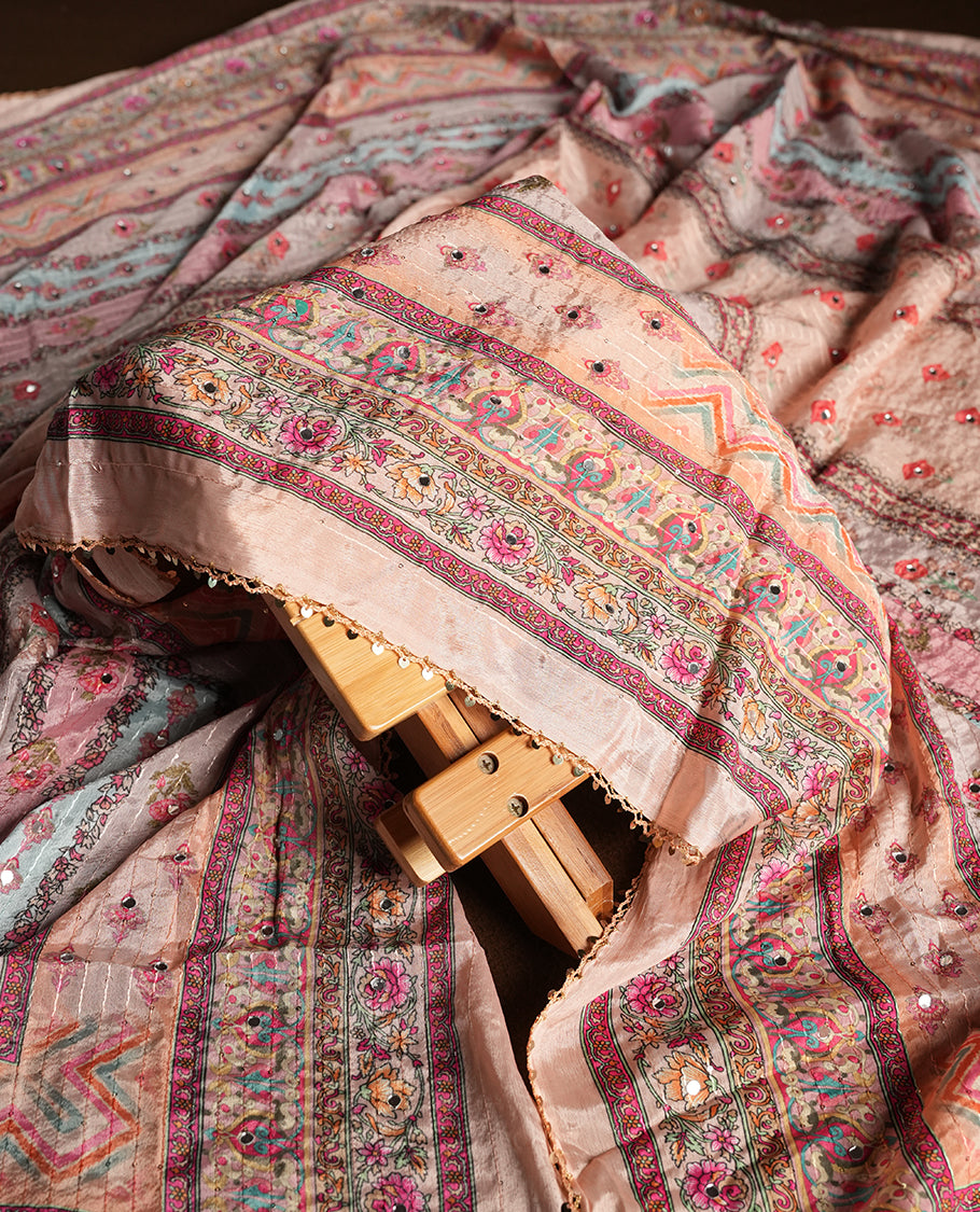 Peach colour churidhar material featuring Mirror and thread embroidery, foral print pattern on the self colour front panel, floral digital printed dupatta with elegant border, and matching plain bottom