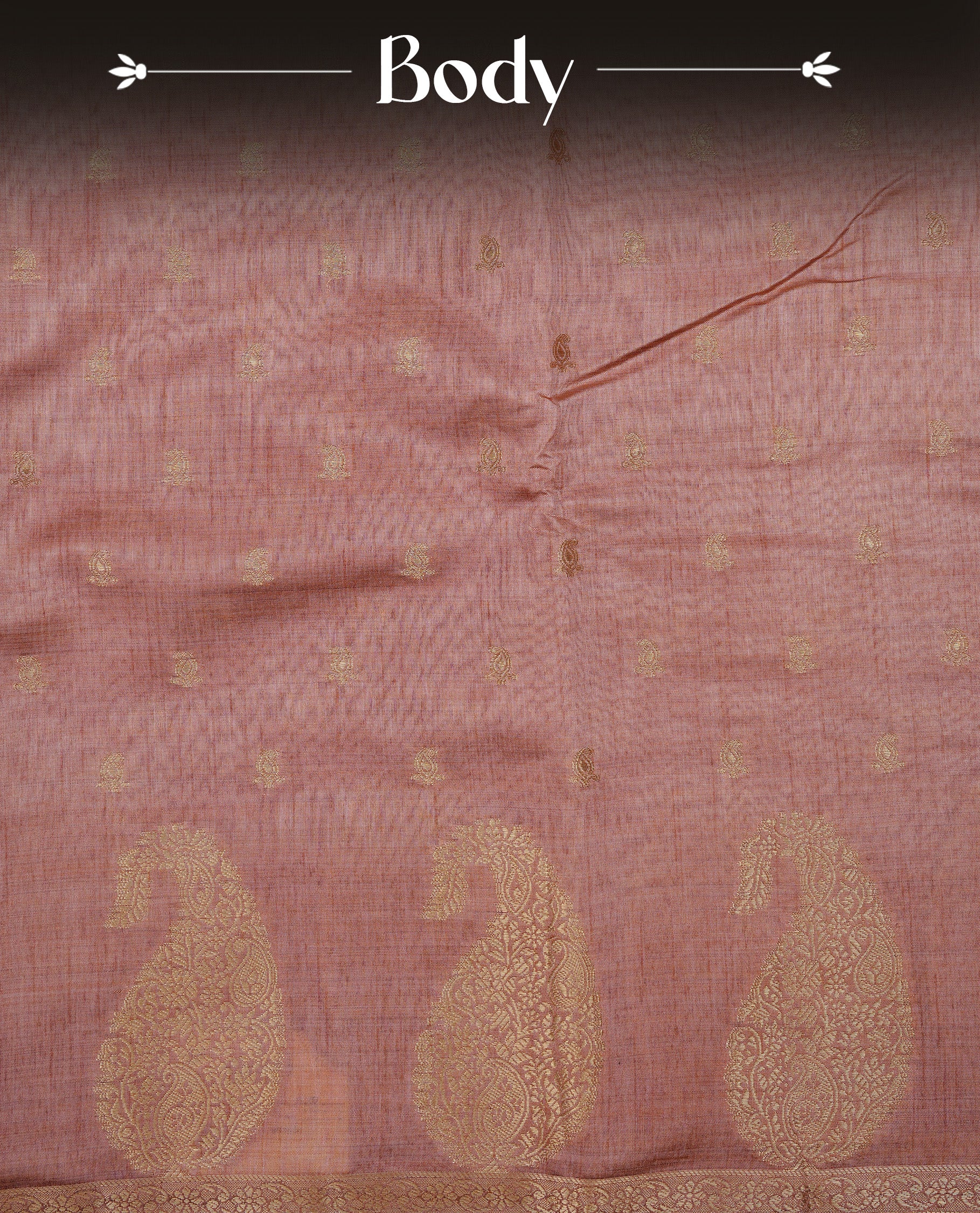 Salmon pink colour semi tussar silk saree featuring small gold zari mango motifs across the body, enhanced with a self colour border showcasing elegant gold zari mango patterns. Paired with a matching blouse piece.