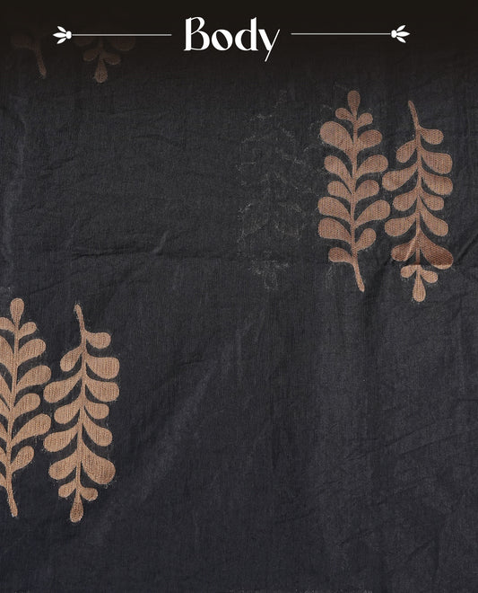 Black colour semi linen saree with elegant gold zari leaf motifs across the body, complemented by a contrast pallu and a borderless design, paired with a matching blouse piece.