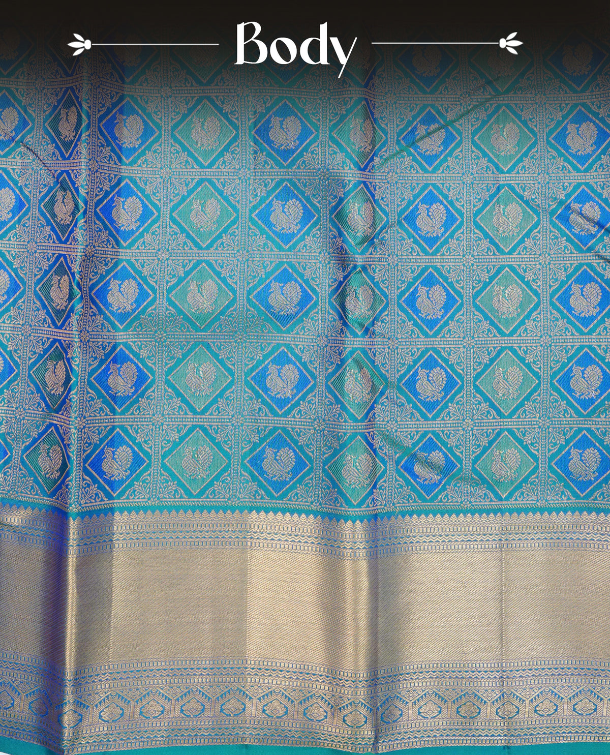 Peacock colour pure wedding silk saree featuring Gold zari inside box diamond with peacock motifs pattern on body, complemented by self colour with traditional border, comes with matching blouse piece.