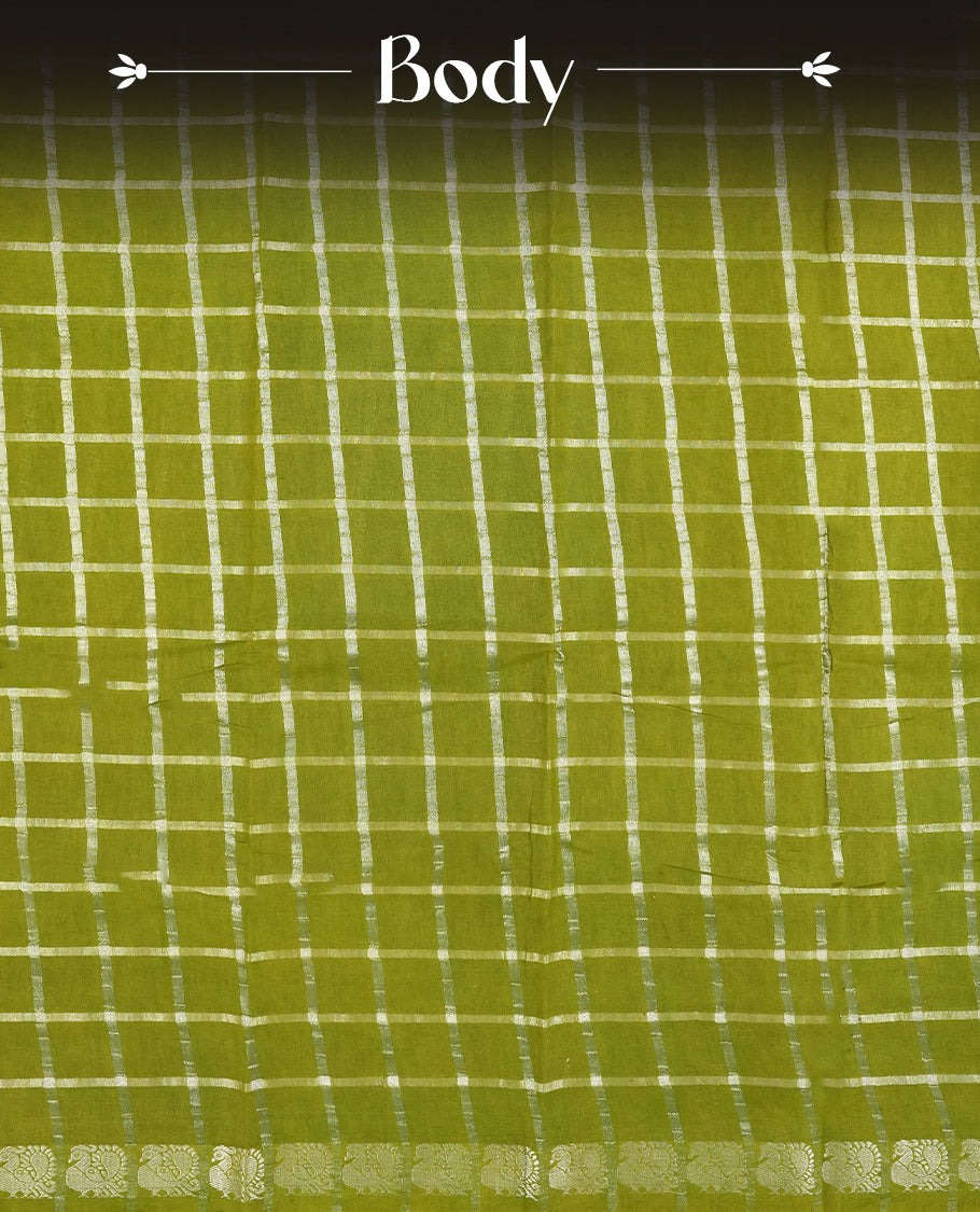 Olive green colour Chettinad cotton saree featuring silver checked patterns on the body, accentuated with elegant silver peacock motifs along the border & Comes with a matching blouse piece.