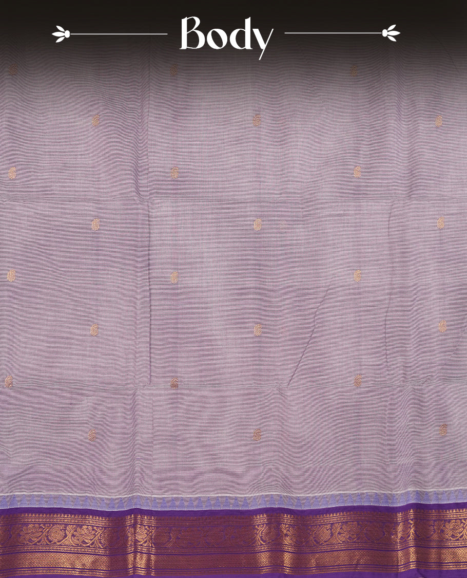 Lavender colour Chettinad cotton saree featuring subtle small motifs on the body, The saree is highlighted with a rich purple zari woven border adorned with floral and geometric patterns & Comes with a matching blouse piece.