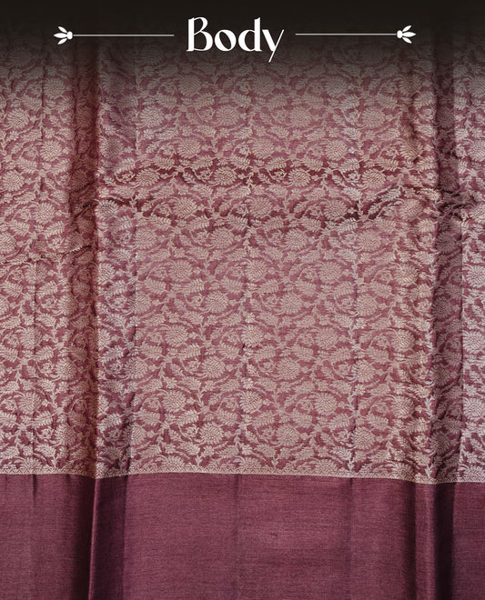 Chocolate Brown colour pure tussar silk saree featuring light gold zari floral kodi work on the body, a plain border, grand pallu,Paired With  a matching blouse piece.