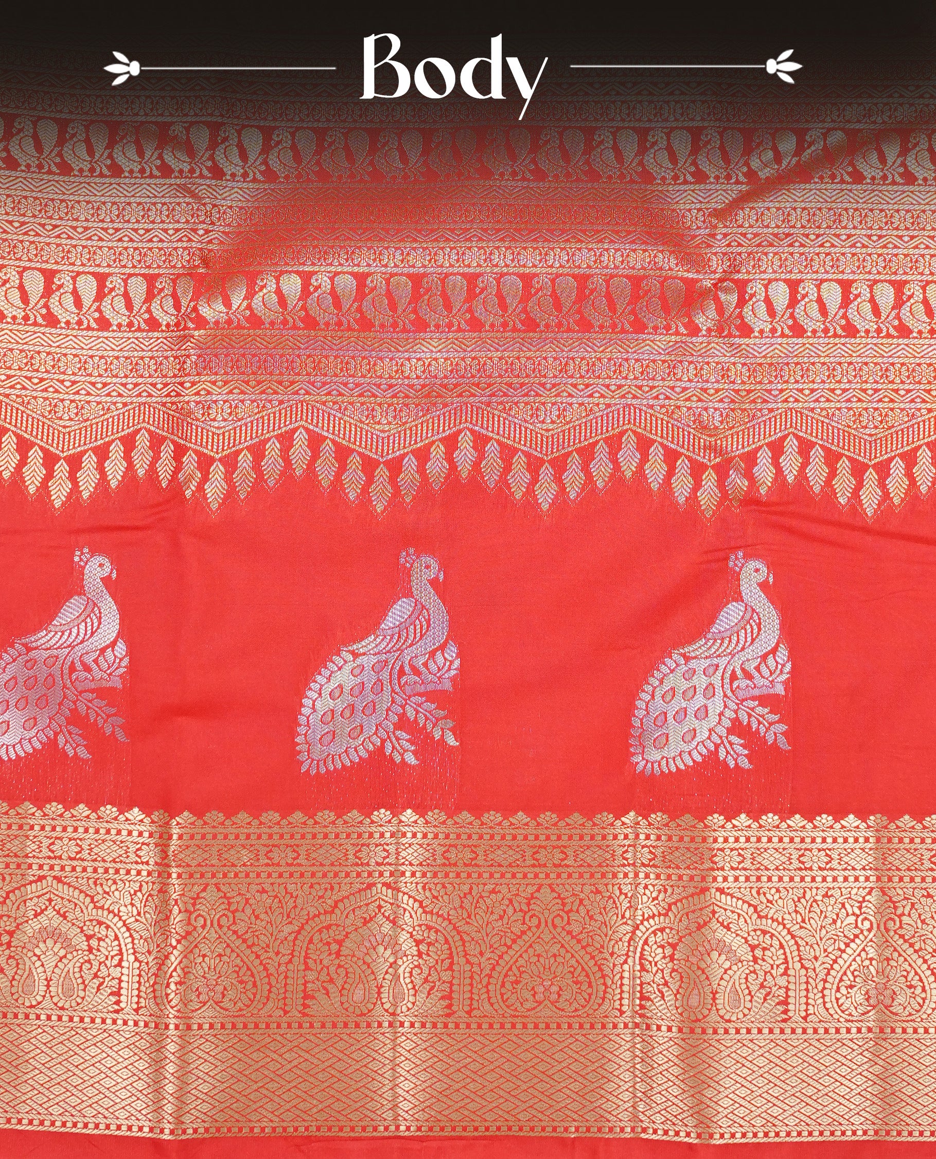 Red colour semi wedding silk saree featuring Gold zari pattern on body, complemented Silver Peacock motifs & gold zari border, paired with matching blouse piece.