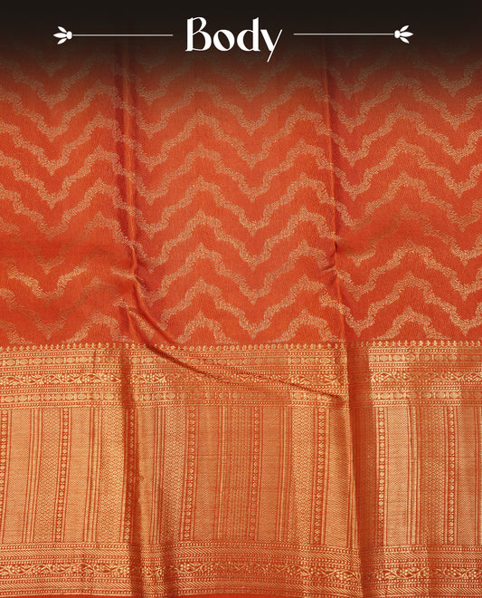 Coral Orange  Colour Pure Kancheepuram Silk Saree Featuring Gold Zari Zig Zag  Pattern on the Body, Highlighting a Traditional Gold Zari Border, Paired with a Matching Blouse Piece.
