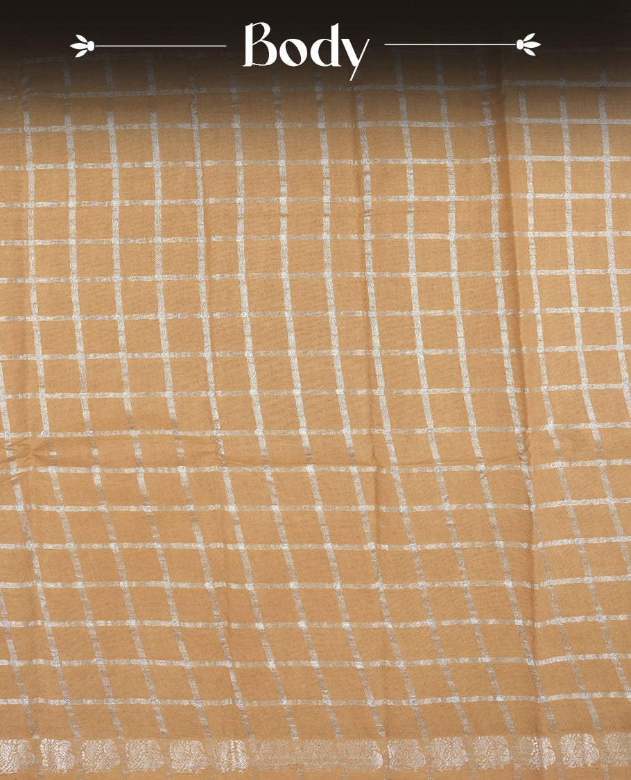 Pastel brown colour Chettinad cotton saree featuring silver checked patterns on the body, accentuated with elegant silver peacock motifs along the border & Comes with a matching blouse piece.