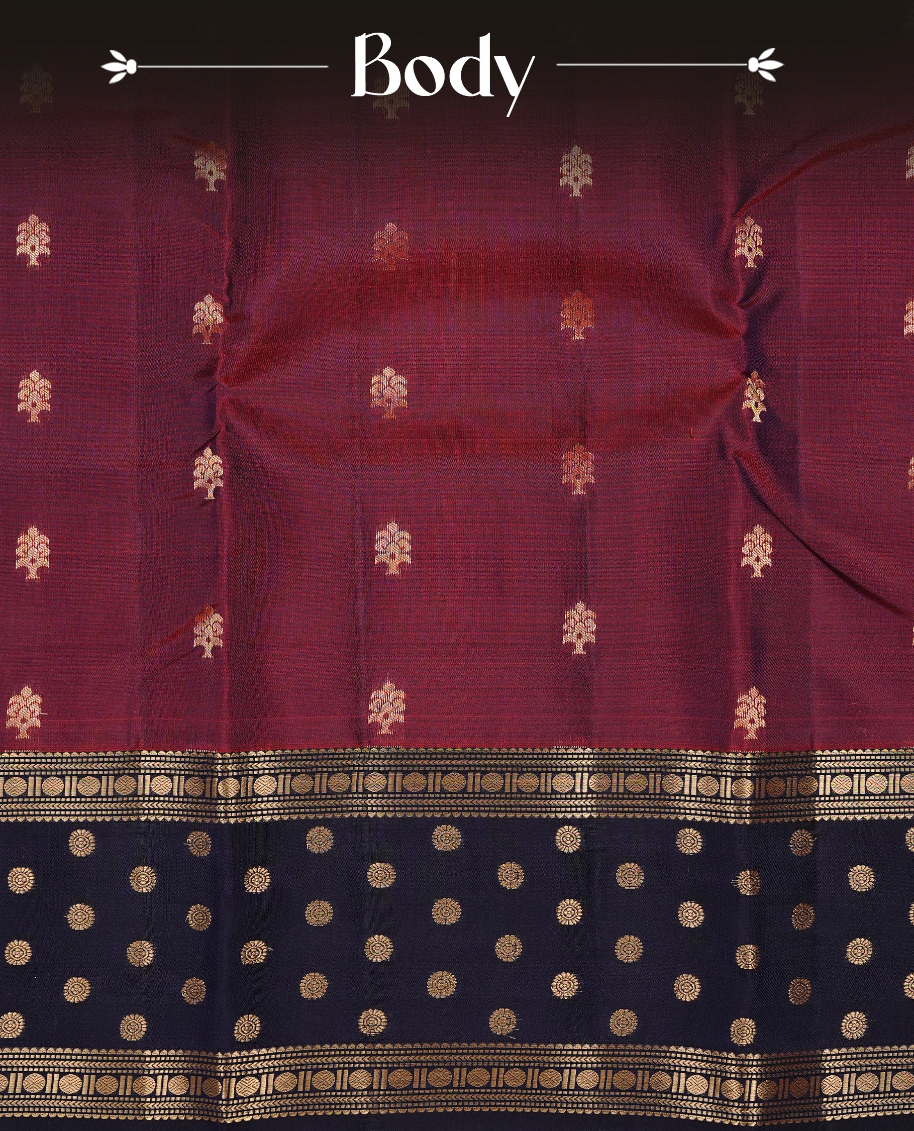 Burgundy colour Traditional Kancheepuram silk saree featuring gold zari motifs on body, enhanced with contrast Dark Blue with traditional border, paired with matching blouse piece.