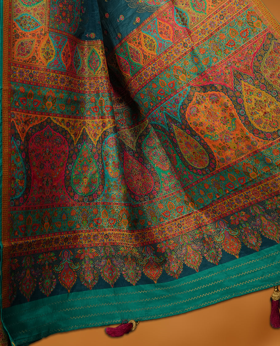 Crystal Teal colour Pashmina silk saree densely woven with intricate multicolour floral and architectural motifs across the body, framed by an opulent arabesque border and grand storytelling pallu, paired with a matching black woven border blouse piece