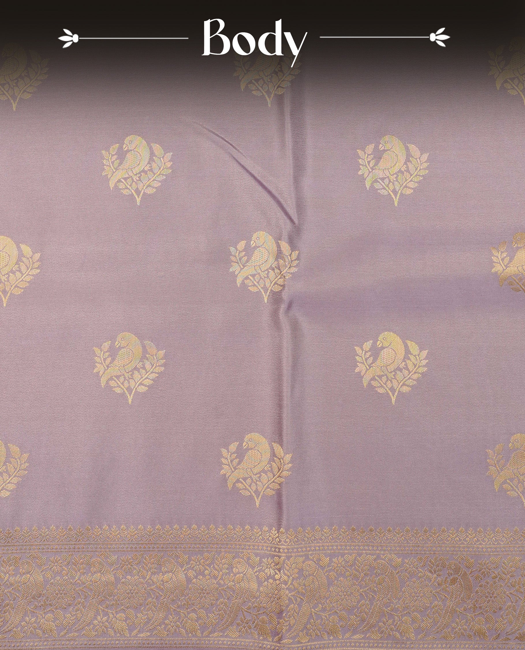 Pastel Lavender colour Mulberry silk saree featuring Gold zari bird motifs on body, complemented by self colour with gold zari border, comes with matching blouse piece.