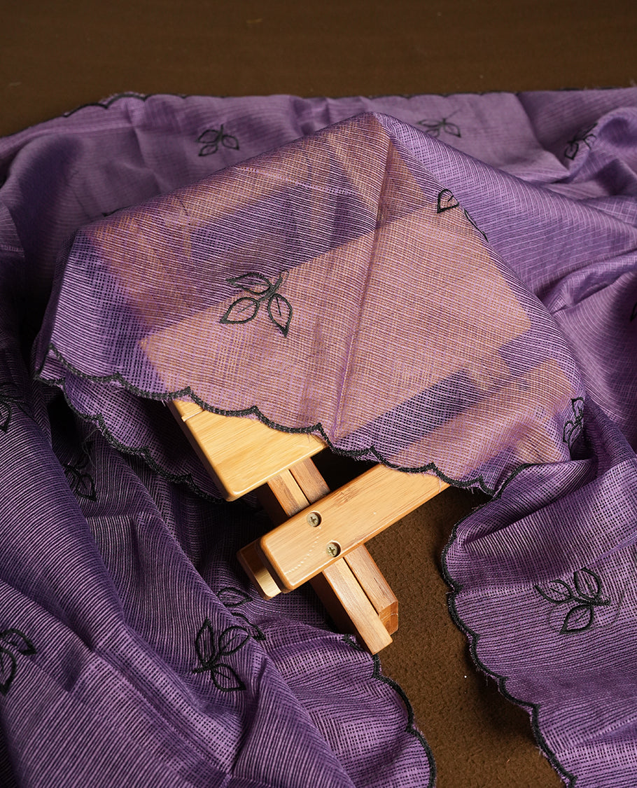 Purple colour churidhar material featuring Black colour thread embroidery on the front panel, self colour dupatta with elegant border, and matching plain bottom