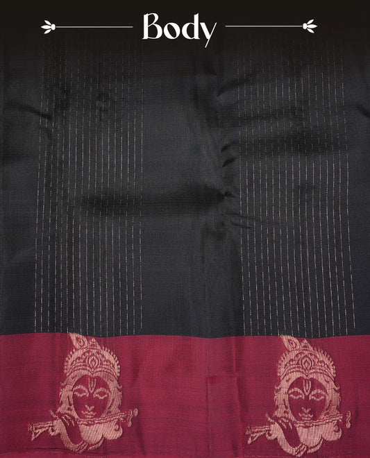 Black  Colour Traditional Kancheepuram Silk Saree Featuring Gold Zari Stripes  on the Body, Designed With Contrast Maroon & Gold Zari Lord Krishna Designed  Pallu, Paired with a Matching Blouse.