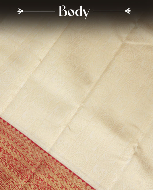 Cream Colour Semi Soft Silk Saree Featuring Gold zari Check With motifs Pattern On Body, Highlighted  by contrast Maroon border with Gold zari, paired with matching blouse piece.