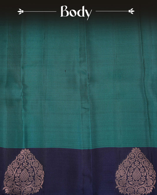 Peacock Green  colour soft silk saree featuring Plain body, complemented by contrast Blue with Rose Gold Zari   border, paired with matching blouse piece.