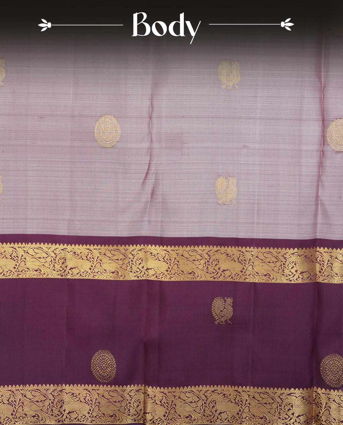 Pinkish grey colour traditional kancheepuram silk saree featuring gold zari chakram & Peacock motifs on body, complemented by contrast Purple colour with Gold zari border, comes with matching blouse piece.