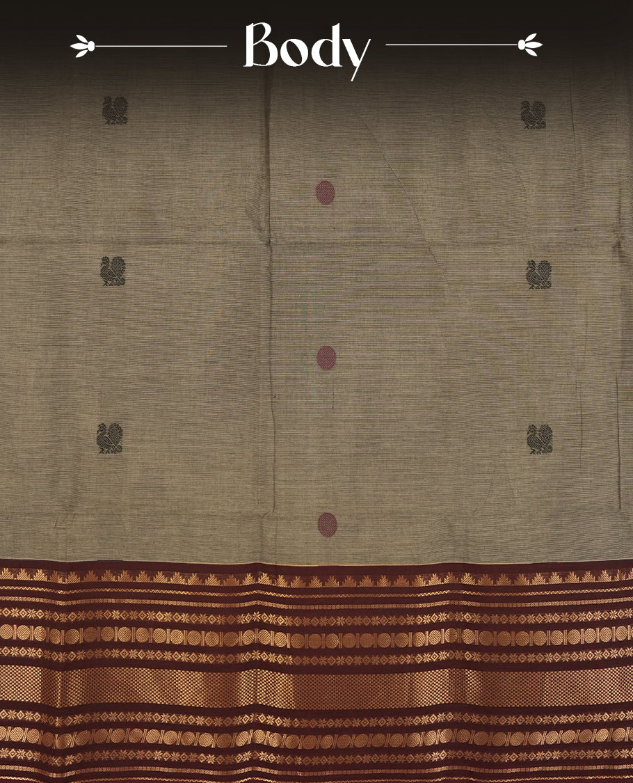 Grey and maroon dual shaded Chettinad cotton saree featuring intricate zari weaving all over the body, Enhanced with a rich maroon zari border and pallu, giving it a traditional and regal appeal & Comes with a matching blouse piece.