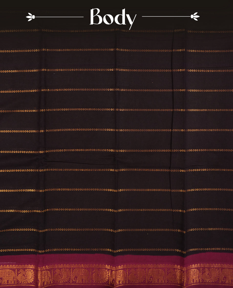Black colour Chettinad cotton saree featuring golden horizontal stripes across the body, accentuated by a burgundy colour border with intricate golden motifs & Comes with a matching blouse piece.