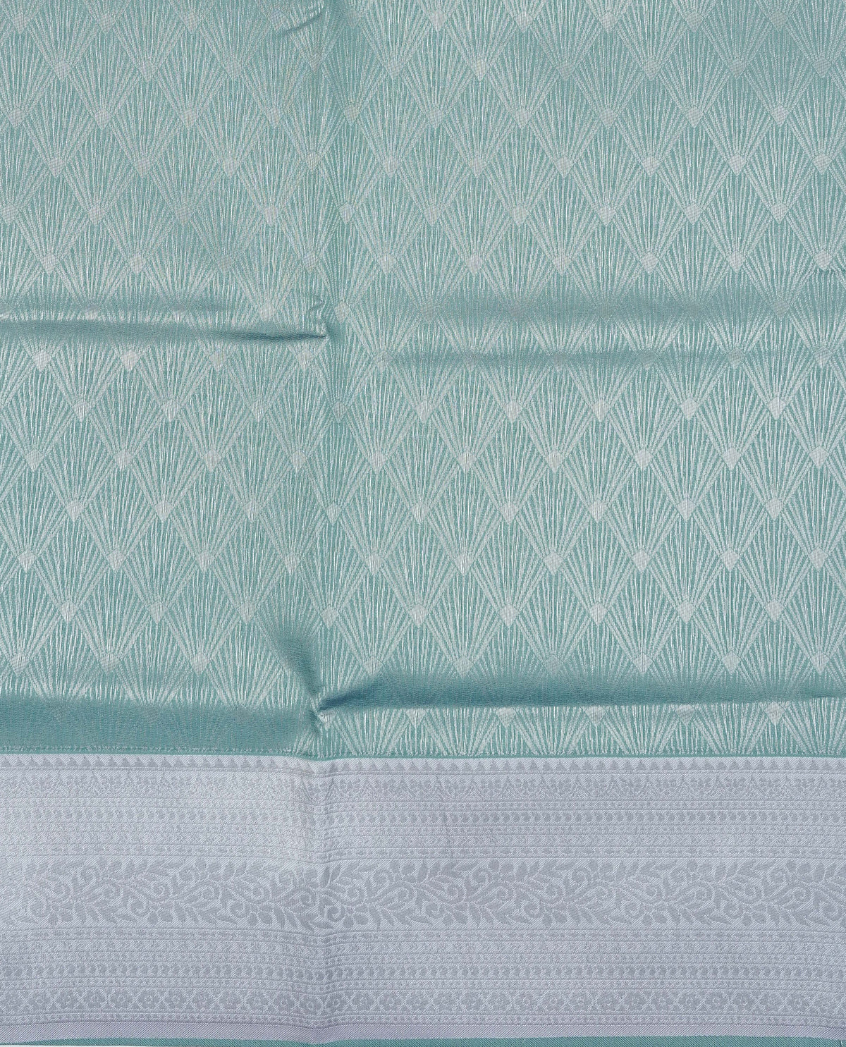 Sea green colour semi silk saree featuring Silver zari Design pattern on body, complemented by contrast Lavender colour with silver zari border, comes with matching blouse piece